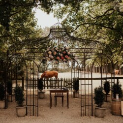 An attractive wedding gazebo nestled under the trees